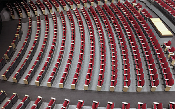 Rows of red seats inside of the Performing Arts Center